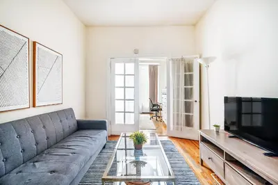 a living room with a couch and a television at 211-3 Prime Union Square Large 1BR Great value in New York