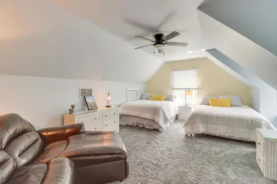 a living room with two beds and a ceiling fan at Calm Columbia Haven Outdoor Pool, Hot Tub! in Delaware Water Gap
