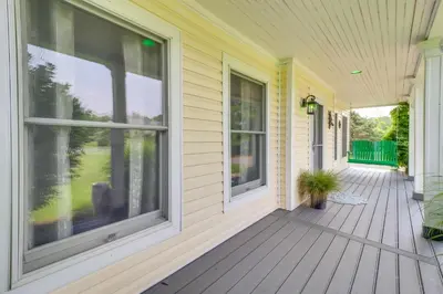 a front porch of a house with large windows at Calm Columbia Haven Outdoor Pool, Hot Tub! in Delaware Water Gap