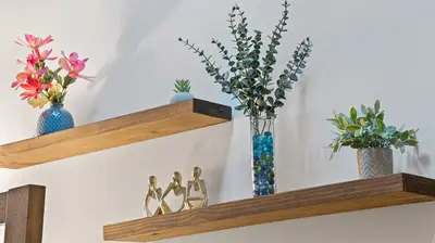 a group of vases on shelves with flowers in them at Chic Penthouse with bus stop at doorstep - 15 Minutes to NYC in Hoboken
