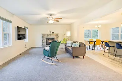 a living room with a couch and a fireplace at 3 Mi to Kalahari Pocono Summit Home with Game Room! in Pocono Summit