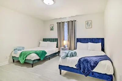 a bedroom with two beds and a window at 3 Mi to Kalahari Pocono Summit Home with Game Room! in Pocono Summit