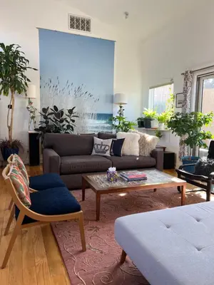 a living room with a couch and a coffee table at Modern loft style 2bed 2bath minutes to Times Square in West New York