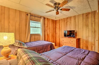 a bedroom with two beds and a ceiling fan at Lake Harmony Access Home with Game Room and Fire Pit! in Lake Harmony
