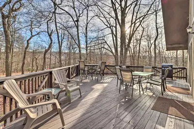 a deck with chairs and tables and a grill at Lake Harmony Access Home with Game Room and Fire Pit! in Lake Harmony