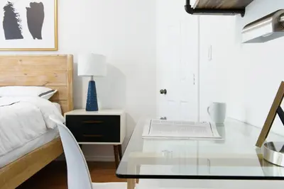 a bedroom with a glass table and a bed at 454-3W PRIME location 2BR Newly Furnished sleeps 5 in New York