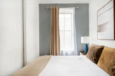a bedroom with a bed and a window at 428-2W Newly Furnished Prime Location 2BR Sleeps 5 in New York
