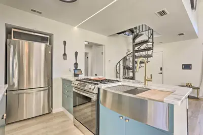 a kitchen with a stainless steel refrigerator and a sink at Hike, Ski and Golf Mtn-View Codo in Vernon Township in Vernon Township