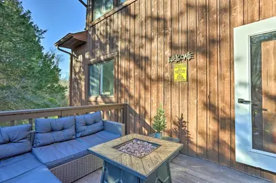 a patio with a couch and a table on a deck at Hike, Ski and Golf Mtn-View Codo in Vernon Township in Vernon Township