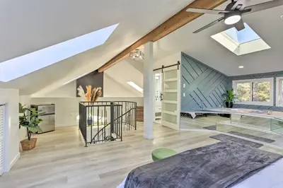 a bedroom with a vaulted ceiling with a skylight at Hike, Ski and Golf Mtn-View Codo in Vernon Township in Vernon Township