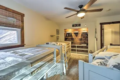 a bedroom with two beds and a ceiling fan at Hot Tub, Beach Access Albrightsville Retreat! in Albrightsville
