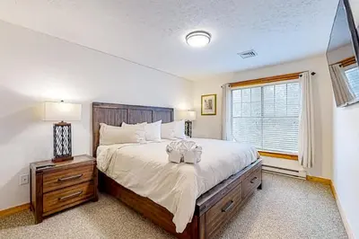 a bedroom with a large bed and a window at Casa Lontano in Tannersville