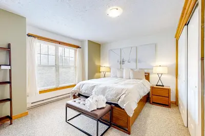 a bedroom with a large bed and a window at Casa Lontano in Tannersville