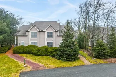 a large house with a driveway in front of it at Casa Lontano in Tannersville