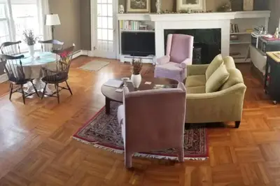 a living room with a couch and a table and chairs at Private Lakeview Cottage and 2 Farmhouse Apartments near Rt 80 easy to NYC in Blairstown