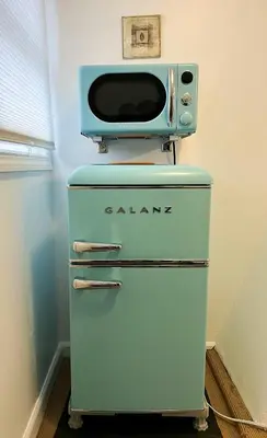 an old refrigerator with a microwave on top of it at Sunny Queen bedroom feel like home!! in Englewood