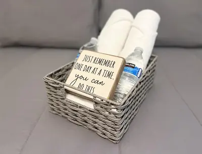 a wicker basket with toilet paper and a message at Sunny Queen bedroom feel like home!! in Englewood