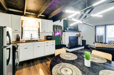 a kitchen with a table and a dining room at Pet-Friendly Cabin in Pocono Lake! in Pocono Lake