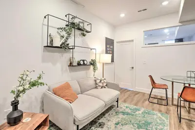 a living room with a couch and a table at Classy Philly Apartment 2 Mi to Downtown! in Philadelphia