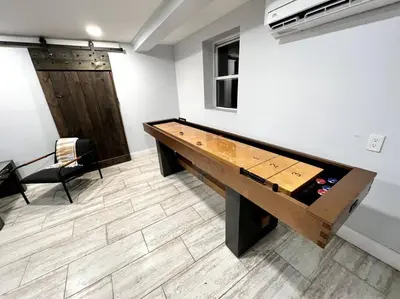 a ping pong table in a room at Cozy Cabin on the Lake w/ HotTub in Hopatcong