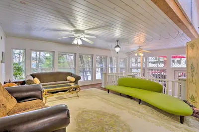 a living room with furniture and a ceiling fan at 1 Mi to Lake Wallenpaupack Spacious Poconos Villa in Hawley