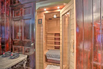 a bathroom with a walk in shower next to a sink at 1 Mi to Lake Wallenpaupack Spacious Poconos Villa in Hawley