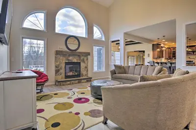 a living room with a couch and a fireplace at Pool and Furnished Patio Group Getaway in Hershey in Hershey