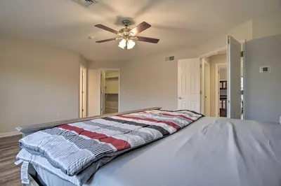 a bedroom with a bed with a ceiling fan at Pool and Furnished Patio Group Getaway in Hershey in Hershey