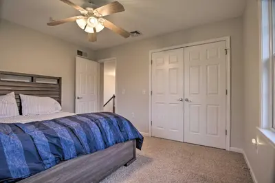 a bedroom with a bed and a ceiling fan at Pool and Furnished Patio Group Getaway in Hershey in Hershey