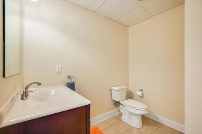 a bathroom with a sink and a toilet at Pool and Furnished Patio Group Getaway in Hershey in Hershey