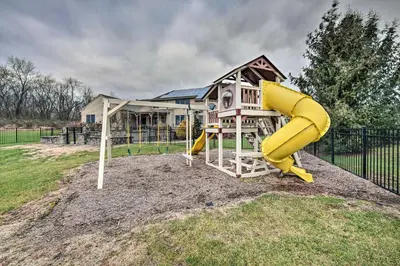 a playground with a slide in a yard at Pool and Furnished Patio Group Getaway in Hershey in Hershey