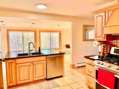 a large kitchen with a sink and a stove at Scenic Views & River Access, Cozy River Home in Montague