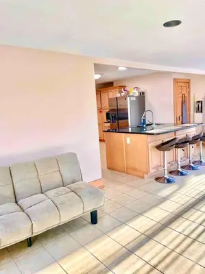 a living room with a couch and a kitchen at Scenic Views & River Access, Cozy River Home in Montague