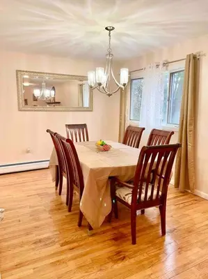 a dining room with a table and eight chairs at Scenic Views & River Access, Cozy River Home in Montague