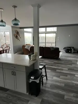 a large living room with a kitchen and a living room at Modern 3BR Townhouse Near Kalahari, Aquatopia & Great Wolf in Tannersville