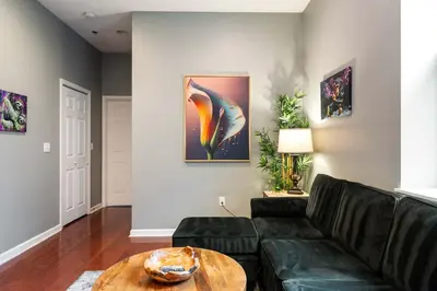 a living room with a couch and a table at Large 3 bdrm apt, 2ba, unique art in Philadelphia