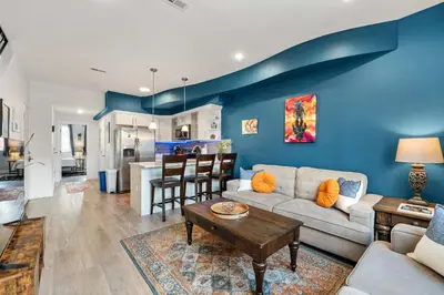 a living room with a couch and a table at Brand New Dbl Unit Roofdeck Outdoor Patio in Philadelphia