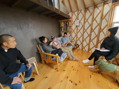 a group of people sitting in a room at Livingston Manor YURT in Parksville