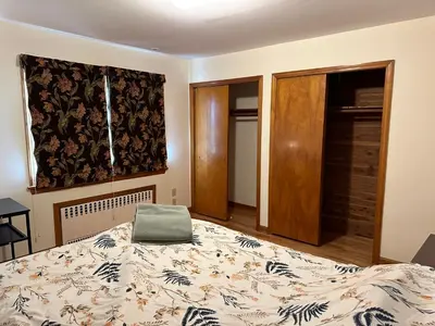 a bedroom with a large bed and a window at M2 Comfortable Room near Rutgers U, hospitals in New Brunswick