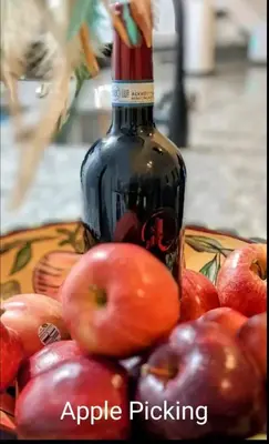 a bottle of apple picking next to a bowl of apples at Great Gorge-ous condo in Vernon Township