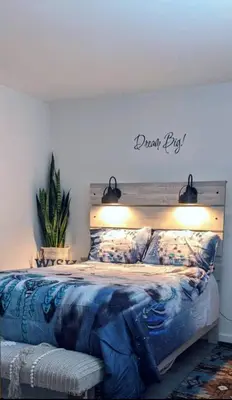 a bedroom with a bed with a sign on the wall at Great Gorge-ous condo in Vernon Township