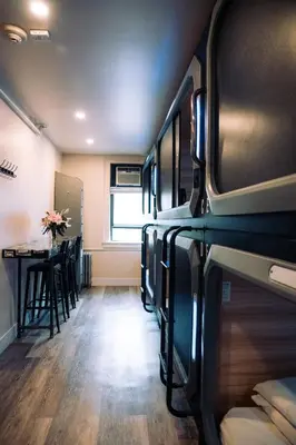 a room with a table and a dining room at KAMA CENTRAL PARK in New York