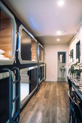 an rv living room with a table and chairs at KAMA CENTRAL PARK in New York