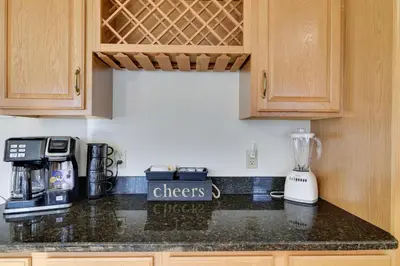 a kitchen counter with a blender on a counter top at Luxury Spacious Home with some FREE Amenities and Activities! in Mushroom Farms