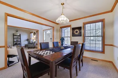 a dining room with a table and chairs at Luxury Spacious Home with some FREE Amenities and Activities! in Mushroom Farms
