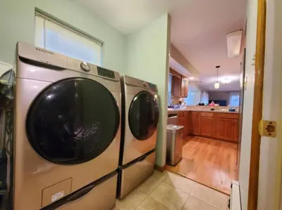 a kitchen with a washer and dryer in a house at Spacious Home by Kalahari Waterpark, Camelback, Jim Thorpe, FREE EV and PRIVATE SAUNA in Albrightsville