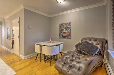 a living room with a couch and a table at Hoboken Condo Walk to Public Transit! in Hoboken