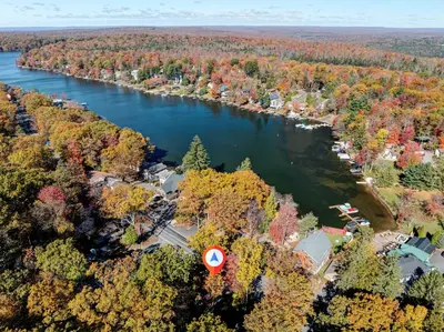 an aerial view of a river with a house at Lake View Enchanted Treehouse- Lake Harmony in Lake Harmony