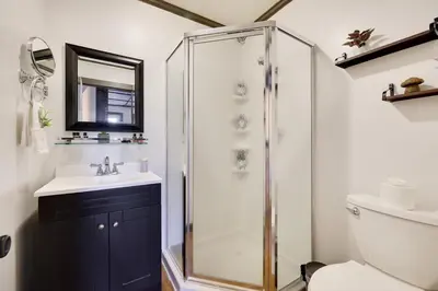 a bathroom with a shower and a sink at Lake View Enchanted Treehouse- Lake Harmony in Lake Harmony