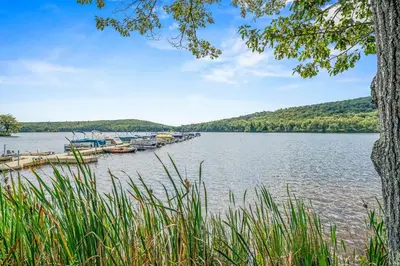 a view of a lake with boats docked at Game Room and BBQ Waterfront Lake Harmony Condo! in Lake Harmony